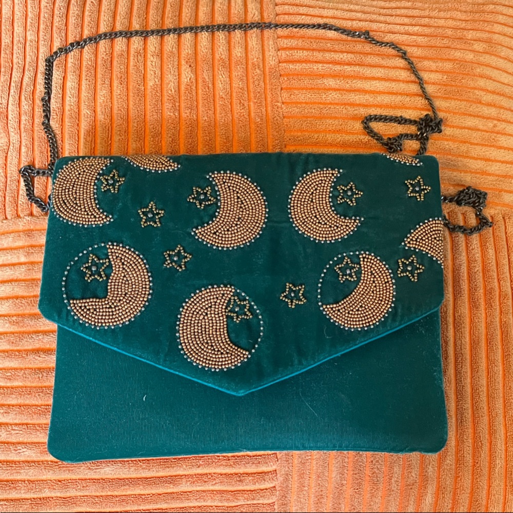 Lulu’s elegant Teal Beaded velour clutch with optional chain